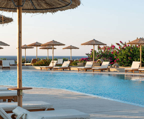 Paralos Rodos Lifestyle Hotel pool, sunbeds and umbrellas